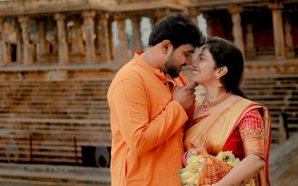 Indian couple in traditional attire at temple
